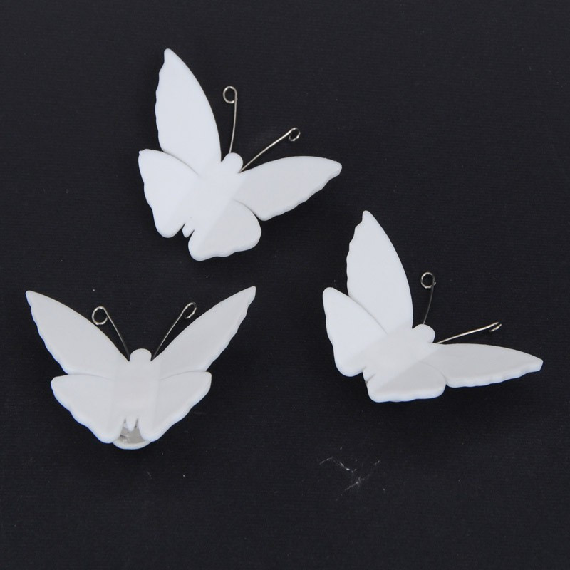 Farfalle decorative in plastica bianca e antenne metalliche